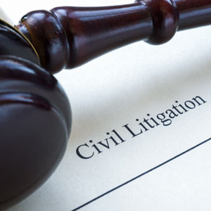  Gavel resting on a document labeled Civil Litigation - Kollias Law